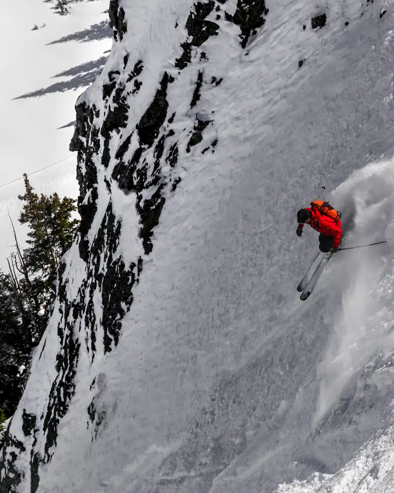 Skier descending chute at Silverton Mountain Ski Area